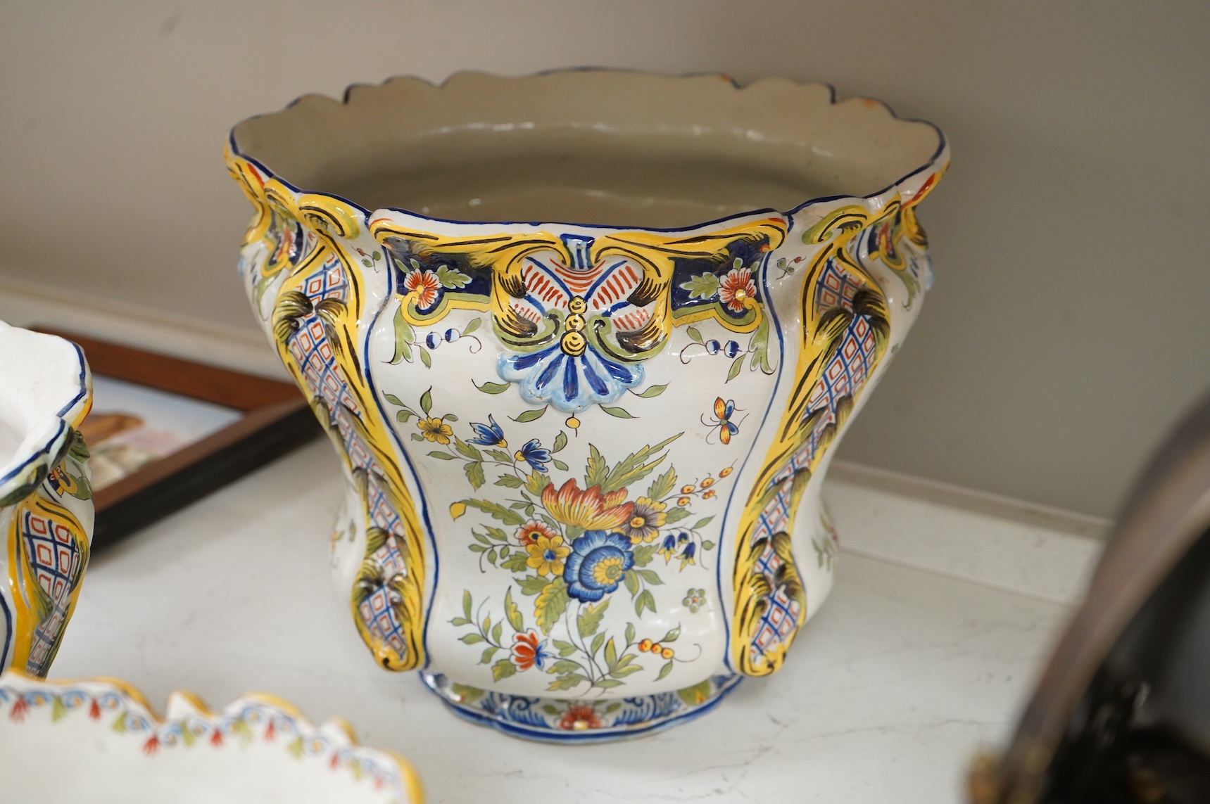 Four various late 19th century French faience planters and jardinières, largest 32cm in diameter